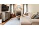 Comfortable living room featuring a fireplace, neutral tones, and a well-lit ambiance at 2212 Oxford Hills Dr, Raleigh, NC 27608