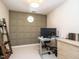 Dedicated office space with an accent wall and built in storage at 2212 Oxford Hills Dr, Raleigh, NC 27608