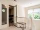 Upstairs landing area with access to a home office and comfortable seating at 2212 Oxford Hills Dr, Raleigh, NC 27608