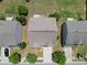 Aerial view of a home showcasing the roof, driveway, and surrounding landscape in a suburban setting at 2412 Averon Dr, Fuquay Varina, NC 27526