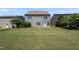 Backyard features a grassy lawn and patio area, perfect for outdoor entertaining at 2412 Averon Dr, Fuquay Varina, NC 27526
