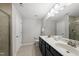 Bright bathroom with double vanity, tile floors, and shower at 2412 Averon Dr, Fuquay Varina, NC 27526