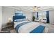 Staged bedroom with soft carpet, tray ceiling, large bed, and lots of light at 2412 Averon Dr, Fuquay Varina, NC 27526