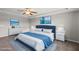 Staged bedroom featuring a large bed, a trey ceiling, and a nautical theme at 2412 Averon Dr, Fuquay Varina, NC 27526