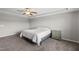 Cozy bedroom with carpet, gray walls, and a comfortable bed at 2412 Averon Dr, Fuquay Varina, NC 27526