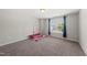 Neutral bedroom featuring soft carpet, and great natural light from the window at 2412 Averon Dr, Fuquay Varina, NC 27526