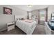 Neutral bedroom offering natural light, soft carpet, and pink accents creating a peaceful vibe at 2412 Averon Dr, Fuquay Varina, NC 27526