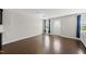 Sun-lit living room with beautiful hardwood floors and neutral walls at 2412 Averon Dr, Fuquay Varina, NC 27526