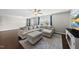 Comfortable living room featuring an L-shaped couch, ceiling fan, and television at 2412 Averon Dr, Fuquay Varina, NC 27526