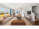 Bright living room with hardwood floors, a large window, couch, and chair at 2412 Averon Dr, Fuquay Varina, NC 27526