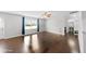 Bright living room features hardwood floors, a large window, and easy access to the back entrance at 2412 Averon Dr, Fuquay Varina, NC 27526