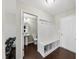 Mudroom with coat rack, bench, and a view into the bathroom at 2412 Averon Dr, Fuquay Varina, NC 27526