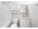 Clean, well-lit bathroom features a tub-shower, updated vanity, and ample storage in a classic white finish at 250 Dixon Rd, Graham, NC 27253