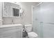 Clean bathroom featuring a vanity, toilet, and glass-enclosed shower with chrome fixtures at 250 Dixon Rd, Graham, NC 27253