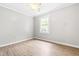 Cozy bedroom with laminate flooring and bright natural light, perfect for rest and relaxation at 250 Dixon Rd, Graham, NC 27253