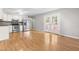 Bright kitchen featuring stainless steel appliances, white cabinetry, and access to outdoor space through stylish French doors at 250 Dixon Rd, Graham, NC 27253