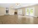 Spacious living room with laminate flooring, a fireplace, and French doors leading to an outdoor area at 250 Dixon Rd, Graham, NC 27253