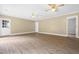 Large living area features laminate flooring, a doorway, and lots of open space for versatile use and design at 250 Dixon Rd, Graham, NC 27253