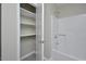 Bathroom features a tiled shower/tub, storage shelves and neutral paint at 2708 Sundial Cir, Durham, NC 27704