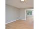 Bright living room featuring neutral walls, wood flooring and a view into the next room at 2708 Sundial Cir, Durham, NC 27704