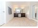 Bright bathroom featuring a double vanity, a soaking tub, and a glass-enclosed shower at 2802 Bingham Dr, Mebane, NC 27302