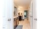 This bathroom features tiled floors and a double sink vanity with storage at 2802 Bingham Dr, Mebane, NC 27302