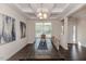 Dining area featuring a large wooden table and stylish coffered ceiling at 2802 Bingham Dr, Mebane, NC 27302