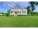 Charming two-story home with a large front yard and inviting covered porch at 2802 Bingham Dr, Mebane, NC 27302