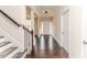 Spacious foyer with hardwood floors, staircase, and view of the front door at 2802 Bingham Dr, Mebane, NC 27302
