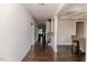 Long hallway with hardwood floors leading to various rooms in the home at 2802 Bingham Dr, Mebane, NC 27302