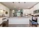 Modern kitchen has center island with granite countertop and stainless steel appliances at 2802 Bingham Dr, Mebane, NC 27302