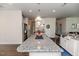 Spacious kitchen island with granite countertop, ideal for meal preparation and casual dining at 2802 Bingham Dr, Mebane, NC 27302