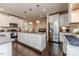 View of kitchen island with white cabinets and stainless steel appliances at 2802 Bingham Dr, Mebane, NC 27302