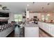View of kitchen with white cabinets and granite countertops at 2802 Bingham Dr, Mebane, NC 27302