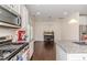Open kitchen flows into the dining area, perfect for entertaining, with stainless appliances at 2802 Bingham Dr, Mebane, NC 27302