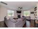 Spacious living room with dark hardwood floors and lots of seating at 2802 Bingham Dr, Mebane, NC 27302