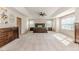 This large bedroom has many windows with a king bed and matching dressers at 2802 Bingham Dr, Mebane, NC 27302