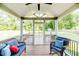 Relaxing screened-in porch with comfortable seating and a view of the wooded backyard at 2802 Bingham Dr, Mebane, NC 27302