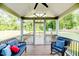 Charming screened-in porch with comfortable seating overlooking the well-maintained yard at 2802 Bingham Dr, Mebane, NC 27302