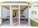 Cozy screened-in porch with seating, offering a view of the expansive backyard at 2802 Bingham Dr, Mebane, NC 27302