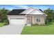 Charming one-story home with a well-maintained lawn, attached garage and delightful curb appeal at 2820 Ricolden Trl, Elon, NC 27244