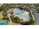 Aerial view showcasing the community pool area with clubhouse, seating, and recreational facilities at 2821 Corbett Grove Dr, Raleigh, NC 27604