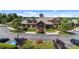 Front view of a beautifully landscaped clubhouse with parking lot at 2821 Corbett Grove Dr, Raleigh, NC 27604