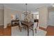Charming dining room with hardwood floors, chandelier, and view into kitchen area at 2821 Corbett Grove Dr, Raleigh, NC 27604
