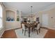 Cozy dining area featuring hardwood floors, chandelier lighting, and an open layout at 2821 Corbett Grove Dr, Raleigh, NC 27604