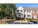 Charming townhome featuring stone accents, neutral siding, and a well-manicured lawn in a desirable community at 2821 Corbett Grove Dr, Raleigh, NC 27604