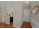 Welcoming foyer with hardwood floors, neutral paint, white door, and stairway access at 2821 Corbett Grove Dr, Raleigh, NC 27604