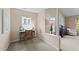 Cozy home office featuring natural light, neutral paint and carpet, and built-in shelving at 2821 Corbett Grove Dr, Raleigh, NC 27604
