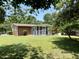 Beautiful backyard with green grass and a screened-in porch at 2909 Sprucewood Dr, Durham, NC 27707