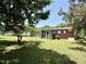 Spacious green backyard with a screened-in porch and a generator at 2909 Sprucewood Dr, Durham, NC 27707
